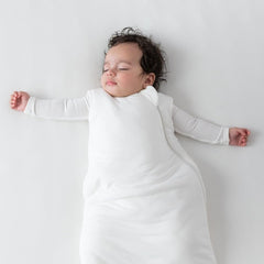 KYTE BABY Cloud sleep bag worn by baby demonstrates wearable blanket for cozy sleep.