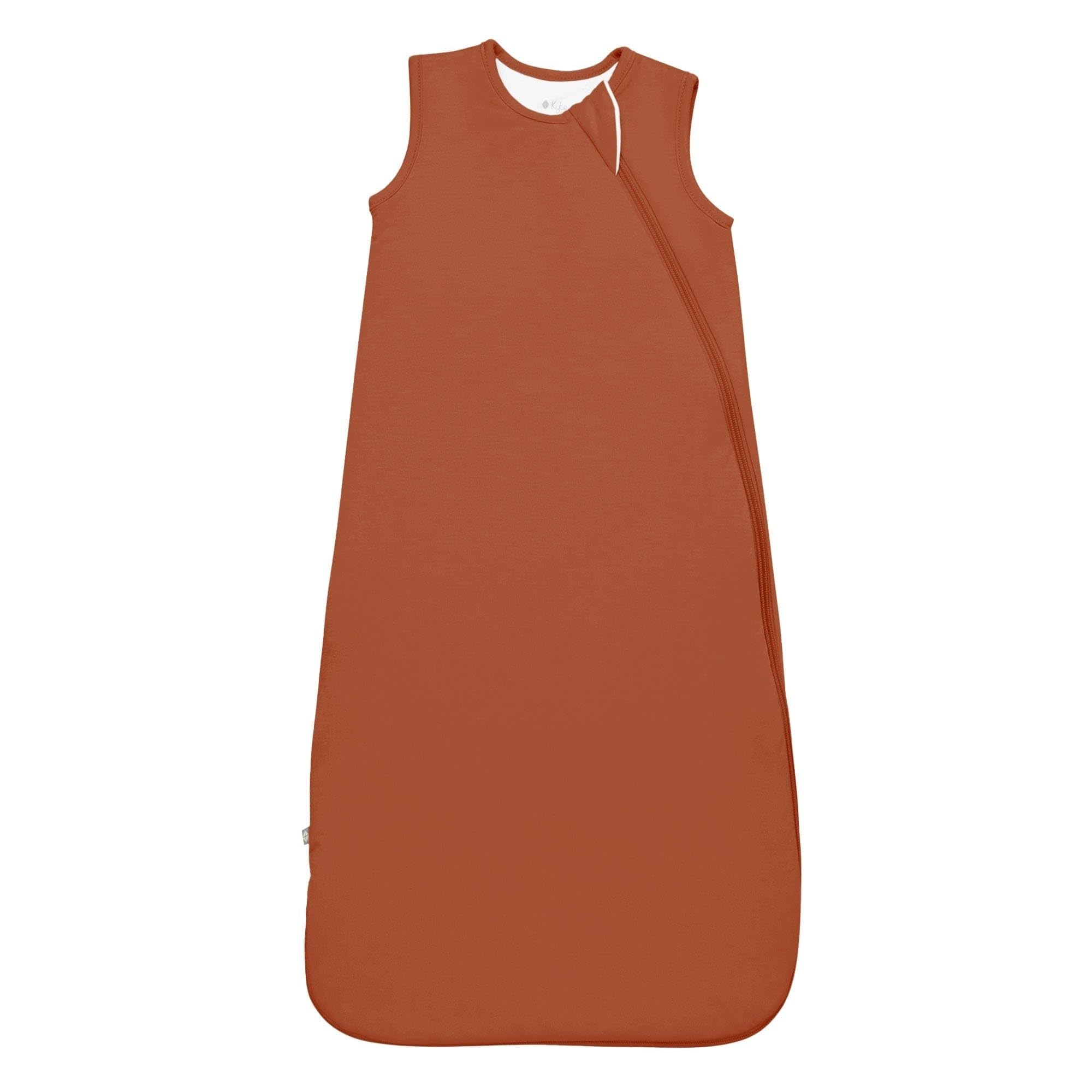Kyte Baby sleep bag rust exterior close-up showing breathable bamboo rayon for comfortable nights.