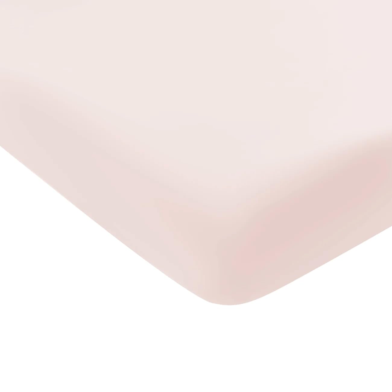Kyte Baby Soft Crib Sheet blush on crib mattress shows soft, breathable fabric in blush
