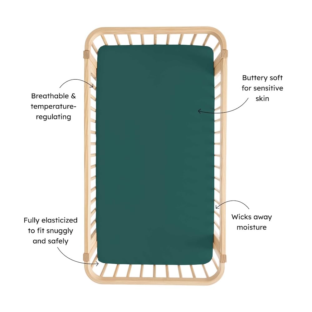 Kyte Baby Emerald crib sheet folded, featuring stretchy fit