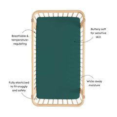 Kyte Baby Emerald crib sheet folded, featuring stretchy fit