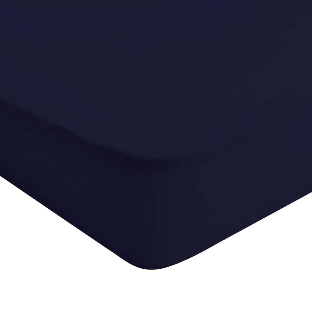 Kyte Baby soft crib sheet navy folded shows breathable bamboo fabric for gentle sleep.