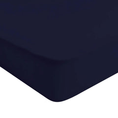 Kyte Baby soft crib sheet navy folded shows breathable bamboo fabric for gentle sleep.