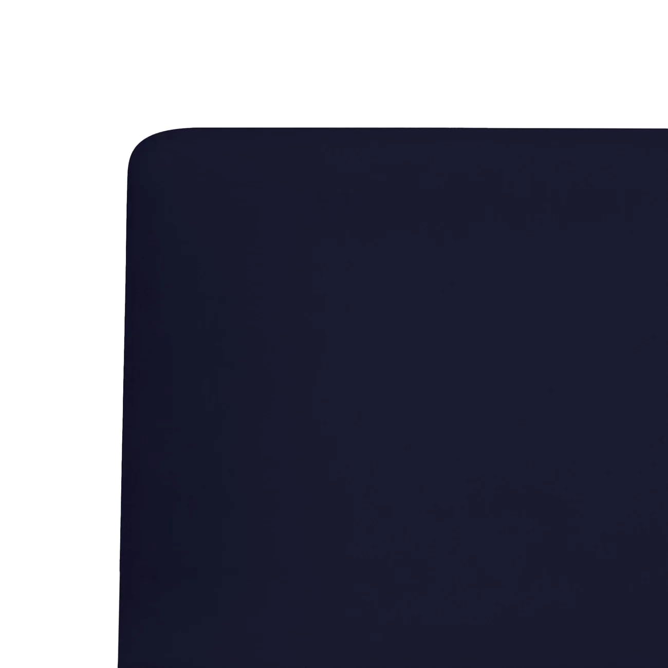 Kyte Baby navy crib sheet on crib demonstrates standard 28x52 fit and breathable rayon.