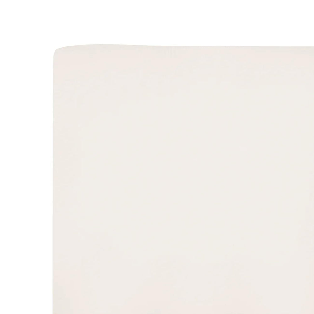 Kyte Baby soft crib sheet oat texture closeup emphasizes silky feel and cozy touch