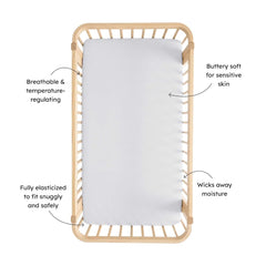Storm fit on crib mattress shows snug secure coverage by KYTE BABY sheet.