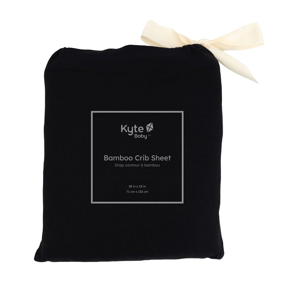 Kyte Baby Soft Sheet Midnight folded neatly demonstrates compact storage.