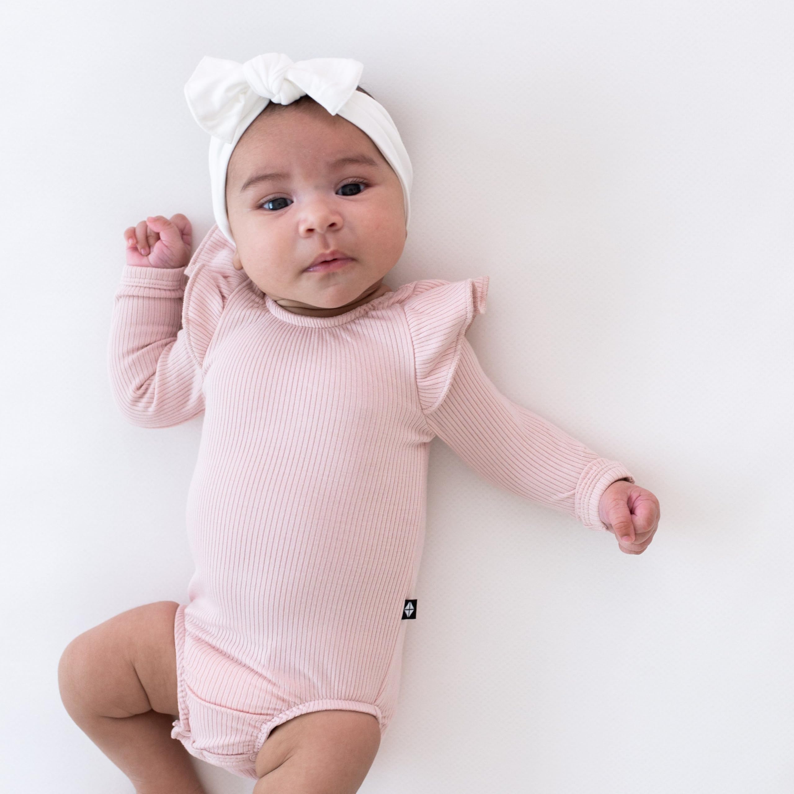 KYTE BABY soft-stretch bamboo bow supports gentle wear and stays in place.