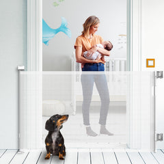 Kyxain retractable gate extended on stairs keeps kids and pets safe.
