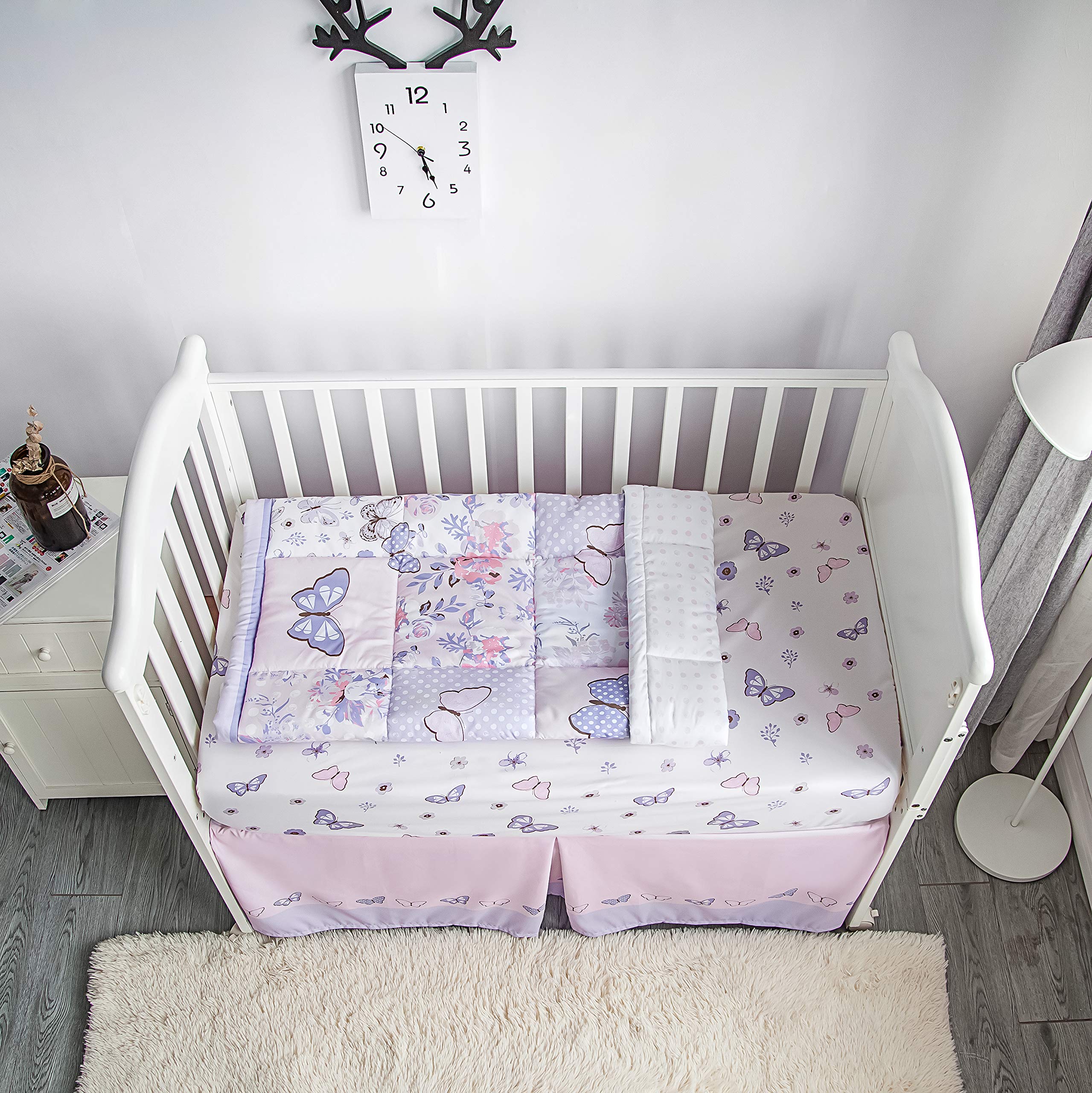 La Premura quilted comforter showcases patchwork floral design for cozy nursery moments.