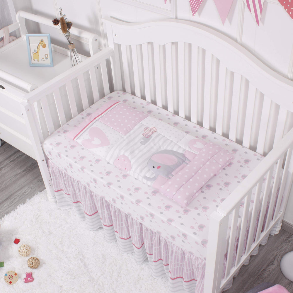 La Premura elephant balloons pattern close-up adds whimsy to a girly nursery.