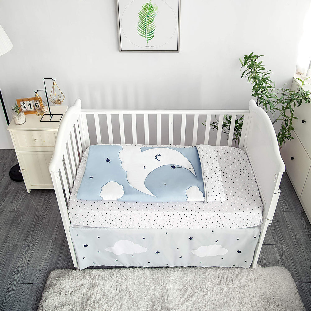 La Premura Sleeping Moon quilt features the sleeping moon motif in soft, reversible design.