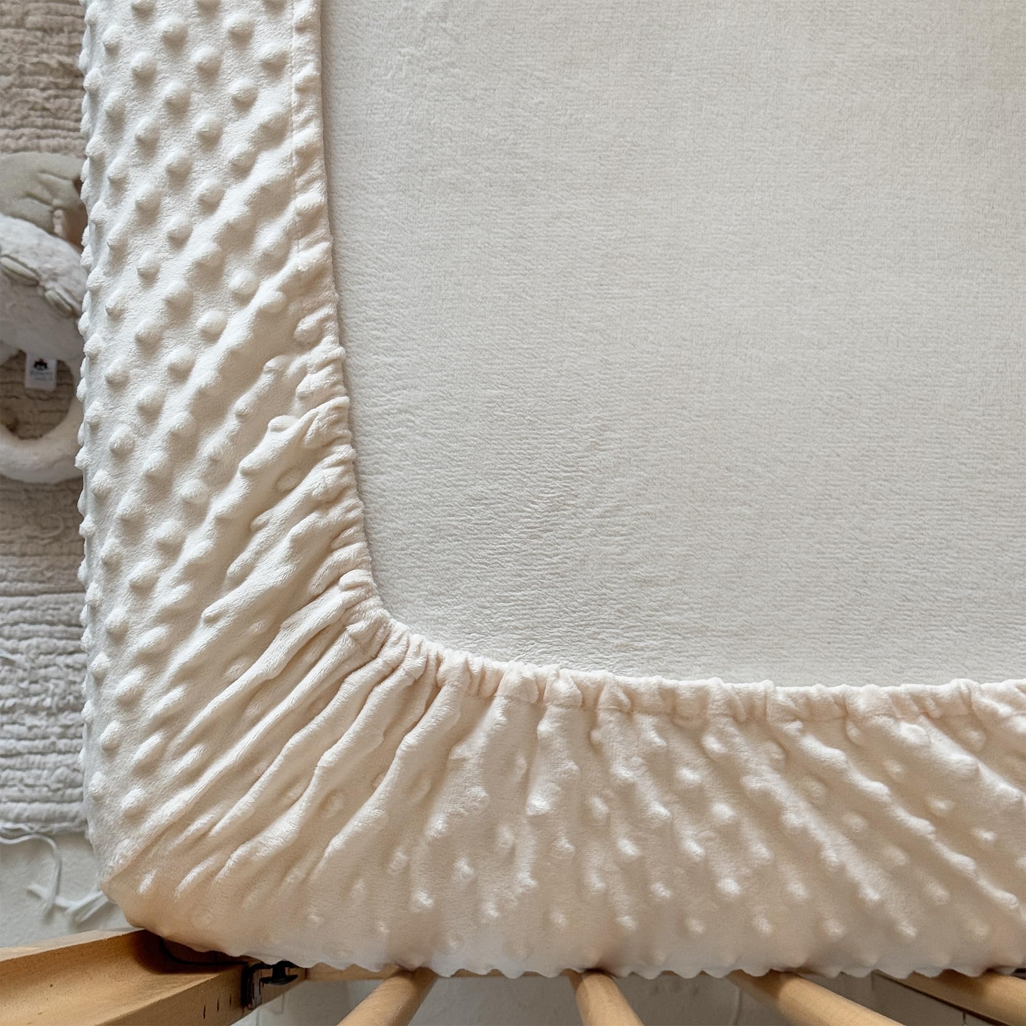 La Sheer green crib sheet offers vibrant, easy-to-match color for nursery decor.