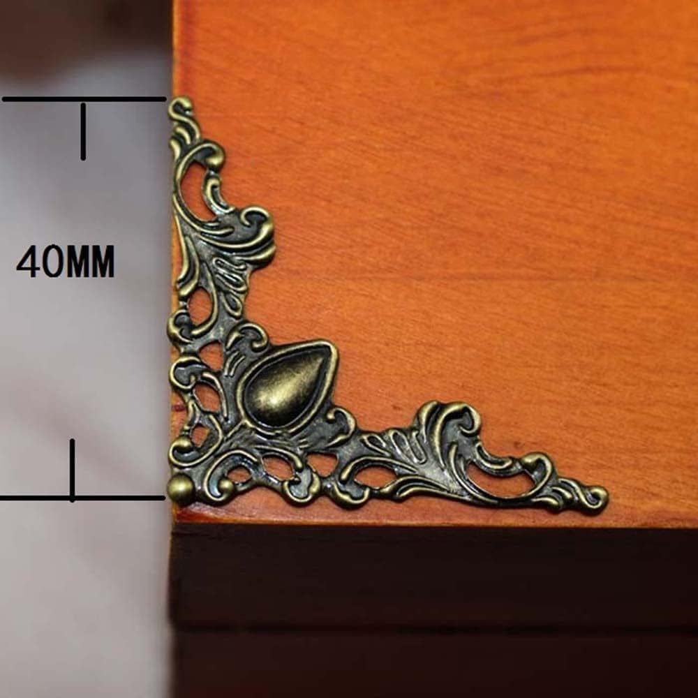 Labriciyon antique bronze corner protector close-up showing floral detail and finish.