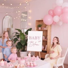 LACEVINE Baby in Bloom decal backdrop highlights a chic photo-op moment.