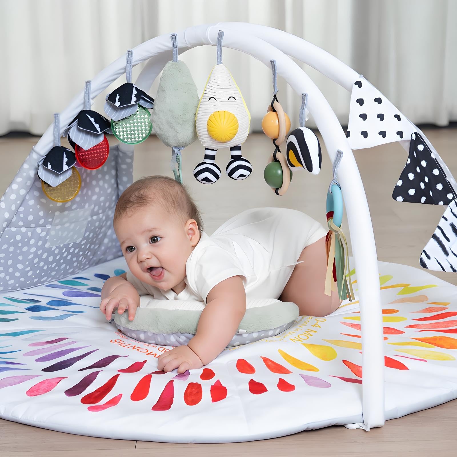 LADIDA Baby Gym Play Mat during tummy time with cushions for gentle support.