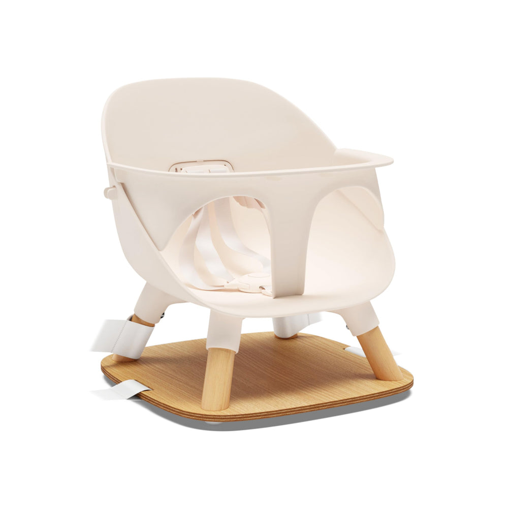 Lalo booster seat Grapefruit front view demonstrates compact, accessible mealtime design.