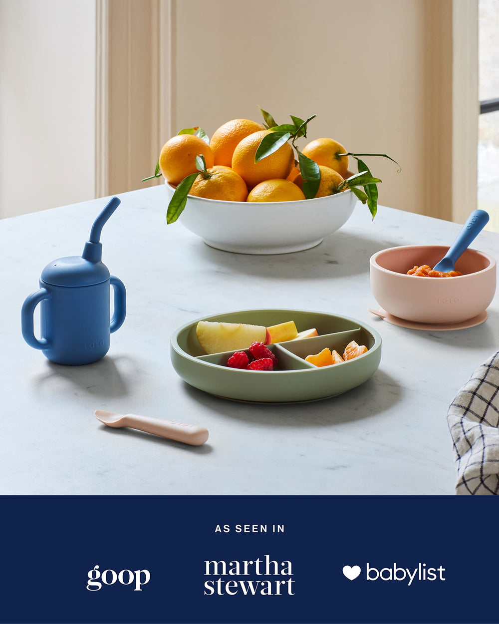 Lalo Little Cup Blueberry leak-proof lid minimizes spills during travel and play.
