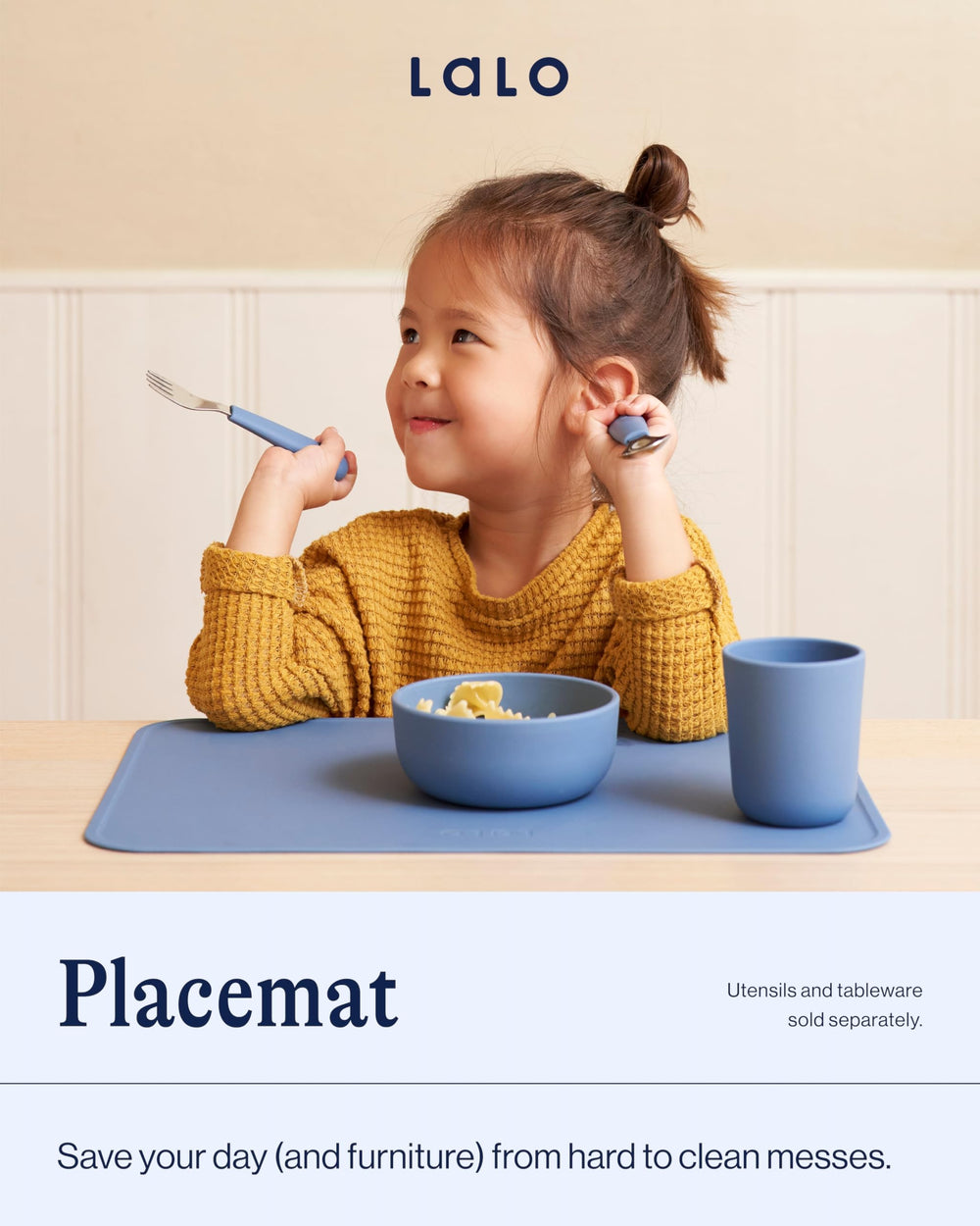 Lalo silicone placemat sage on dining table shows non-slip grip during family meals.