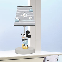 Lambs & Ivy gray and white lamp shade coordinates with nursery decor for a calming look.