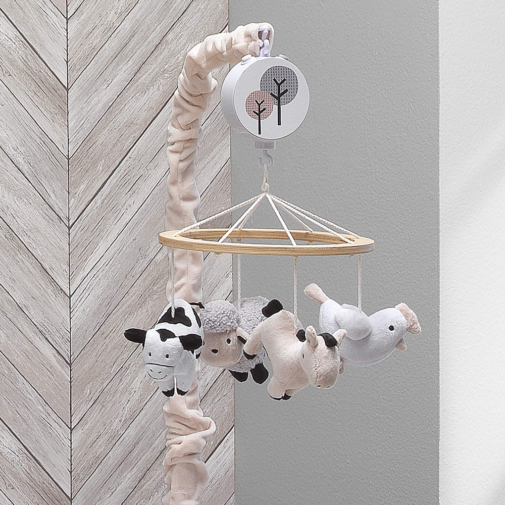 Lambs & Ivy sheep plush detail offers gentle tactile stimulation.