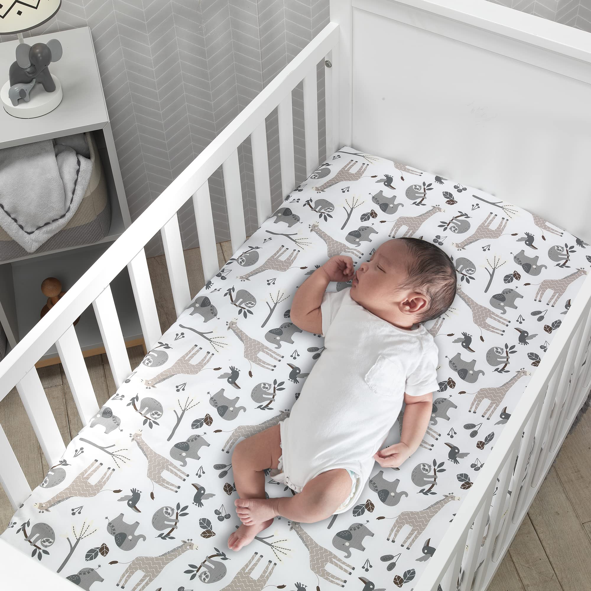Lambs & Ivy Baby Jungle elephants pattern with elastic edge promotes secure fit.