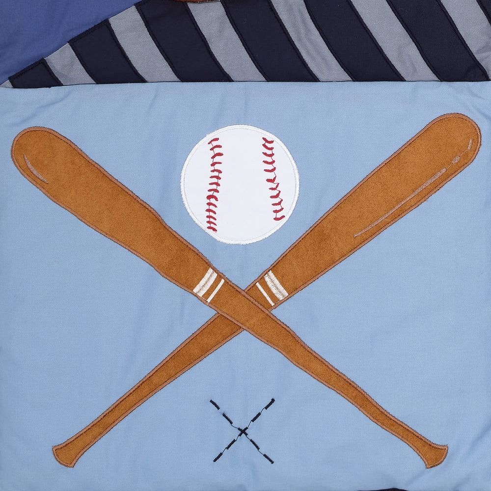 Lambs & Ivy quilt embroidery highlights sports-themed decorative details.