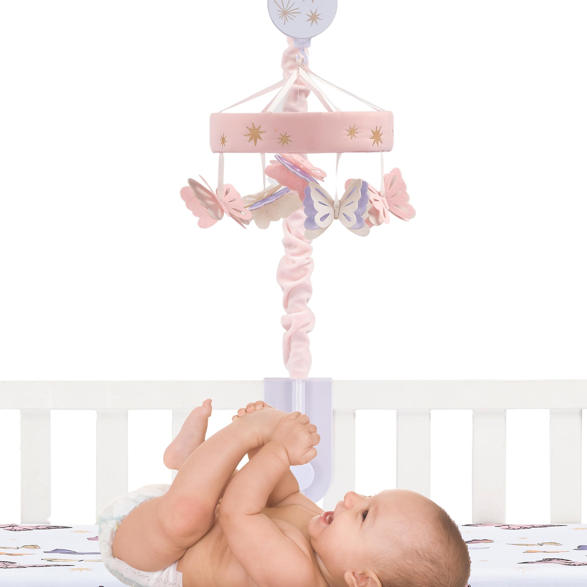 Lambs & Ivy Butterfly Dreams mobile attached to crib with visible controls for ease of use.