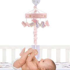 Lambs & Ivy Butterfly Dreams mobile attached to crib with visible controls for ease of use.