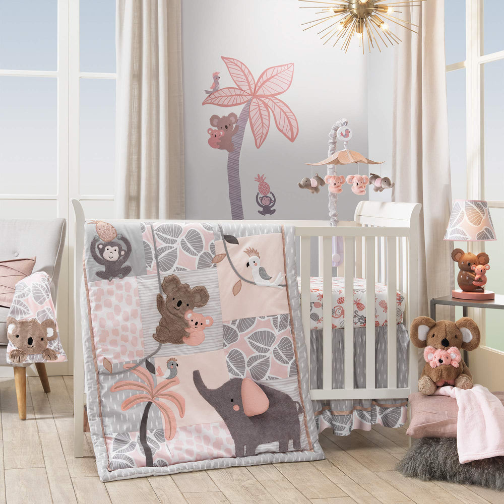 Pink-gray Lambs & Ivy Calypso crib mobile shown in crib setup.