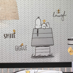 Lambs & Ivy Classic Snoopy Woodstock decals brighten crib walls with cheerful vibes.
