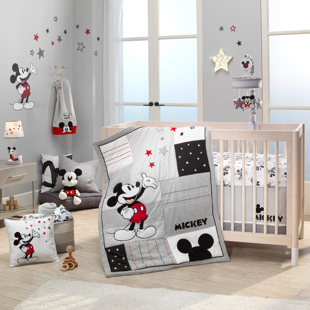 Lambs & Ivy gray crib mobile aids sleep with gentle motion.