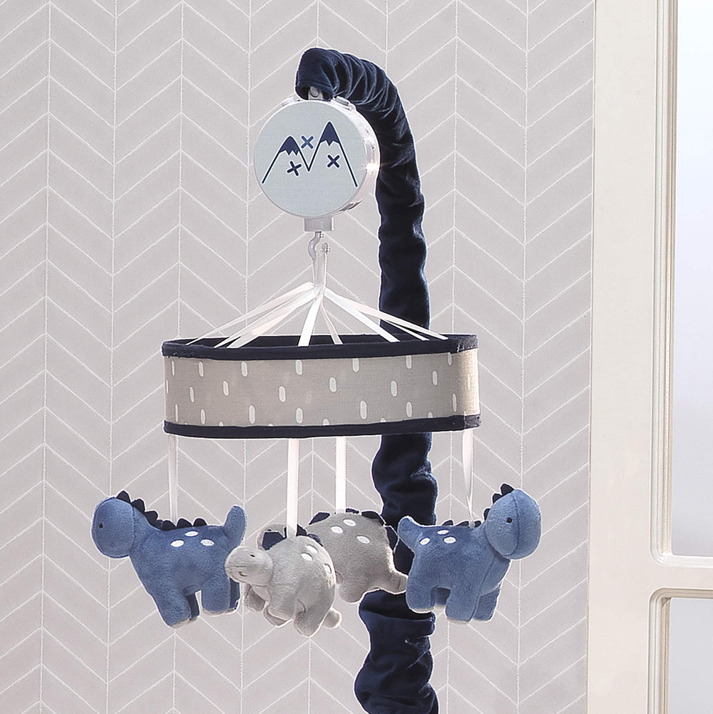 Lambs & Ivy dino mobile with navy velour scrunchie covers arm attachment for neat setup