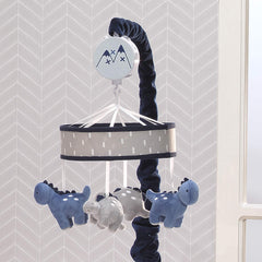 Lambs & Ivy dino mobile with navy velour scrunchie covers arm attachment for neat setup
