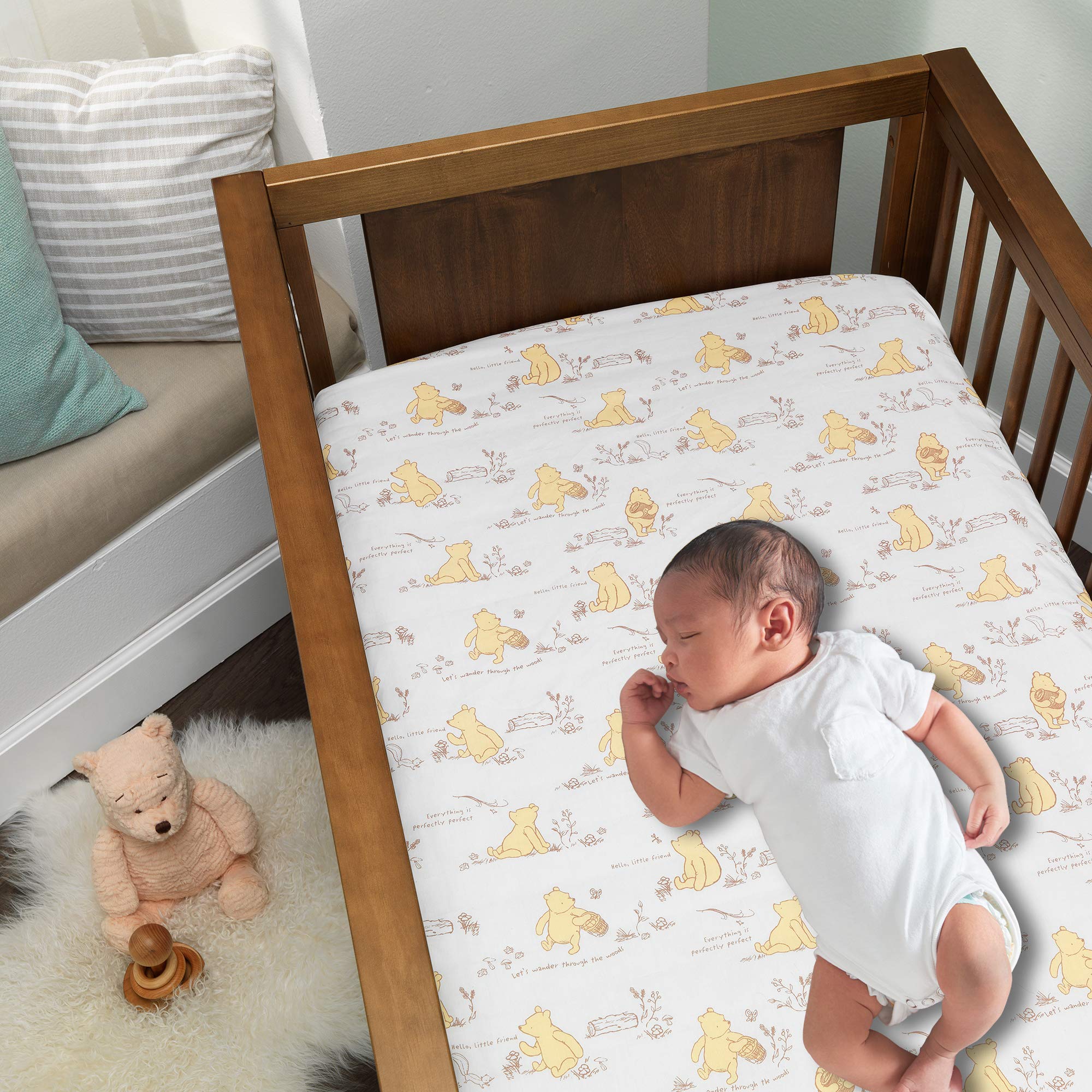 Lambs & Ivy Pooh Storytime crib skirt with 14-inch drop for a polished nursery base.