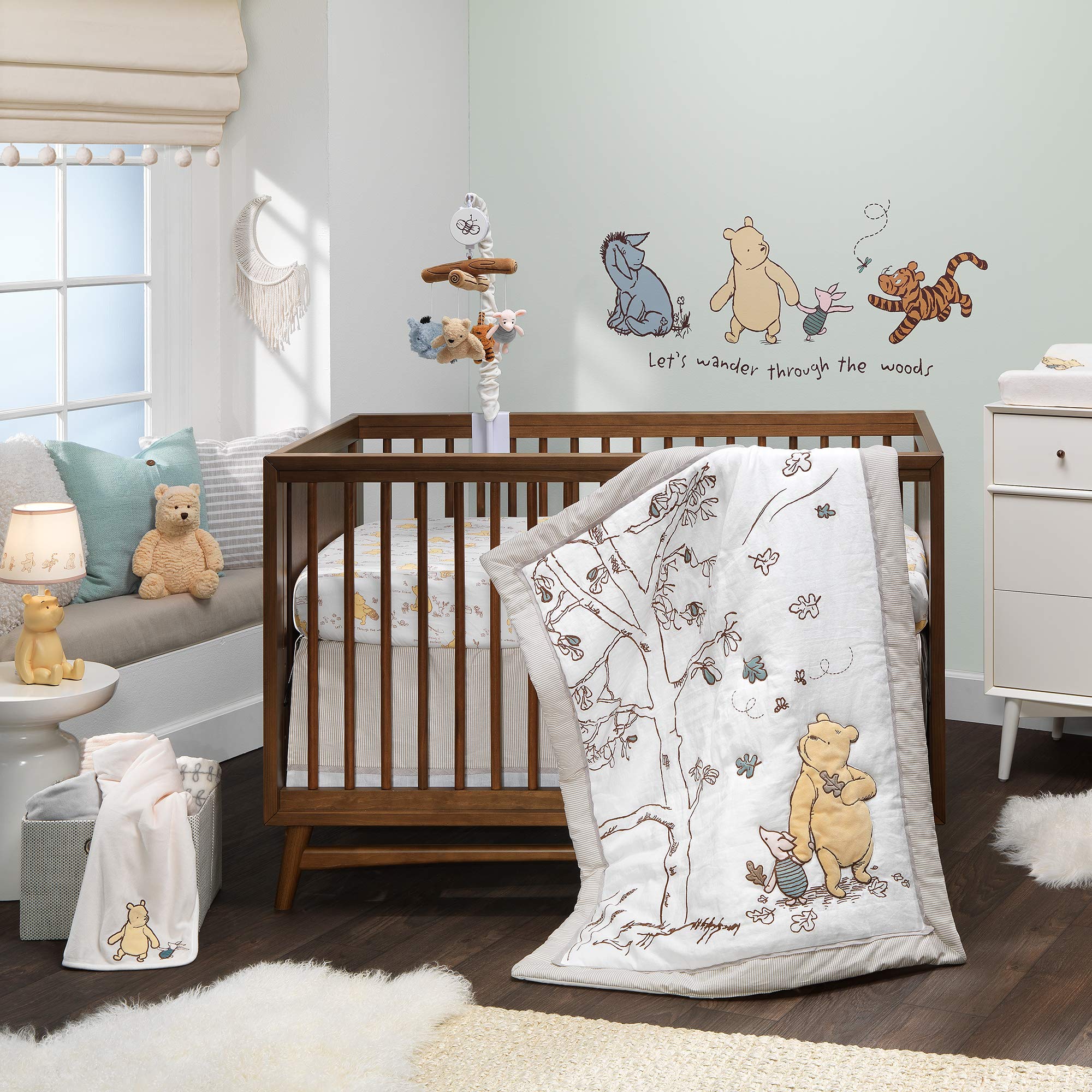 Lambs & Ivy Disney Baby Storytime Pooh sheet folded for easy storage and gifting.