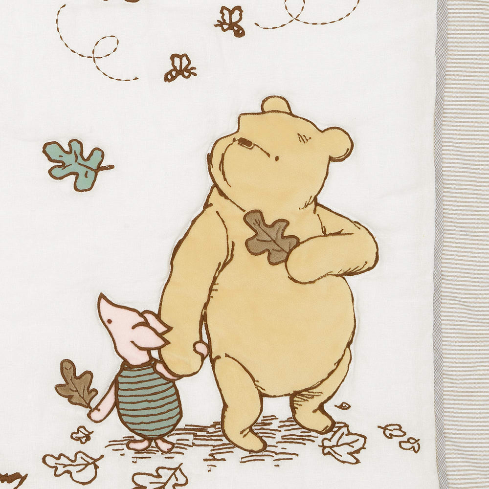 Lambs & Ivy quilt embroidery close-up highlighting premium craftsmanship.
