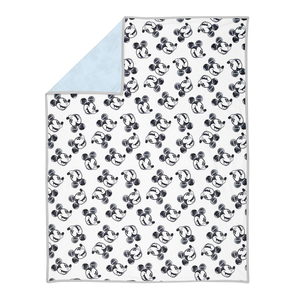 Lambs & Ivy Mickey blanket back features blue jersey for breathable comfort.