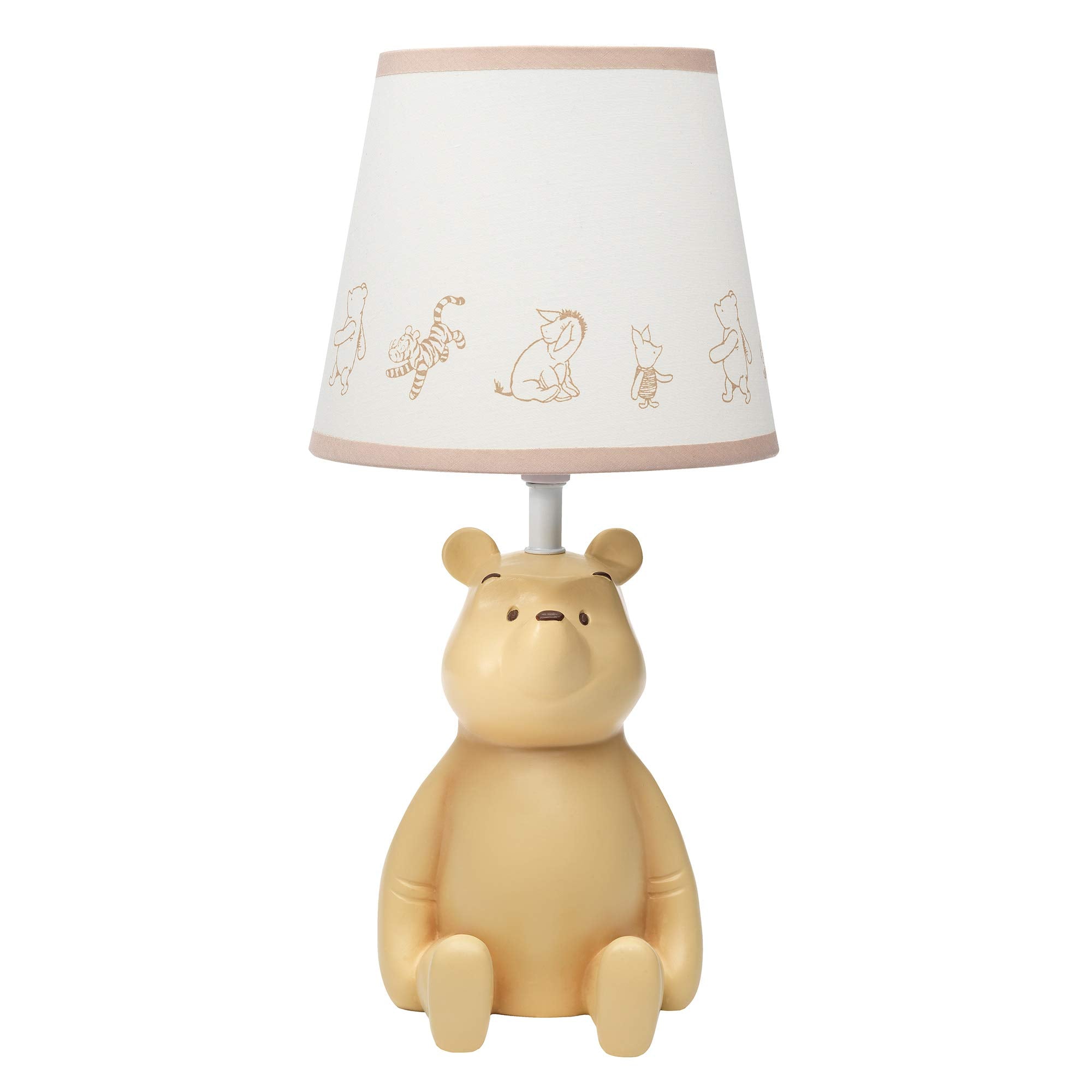 Lambs & Ivy Pooh 3D table lamp glows softly for nursery lighting.