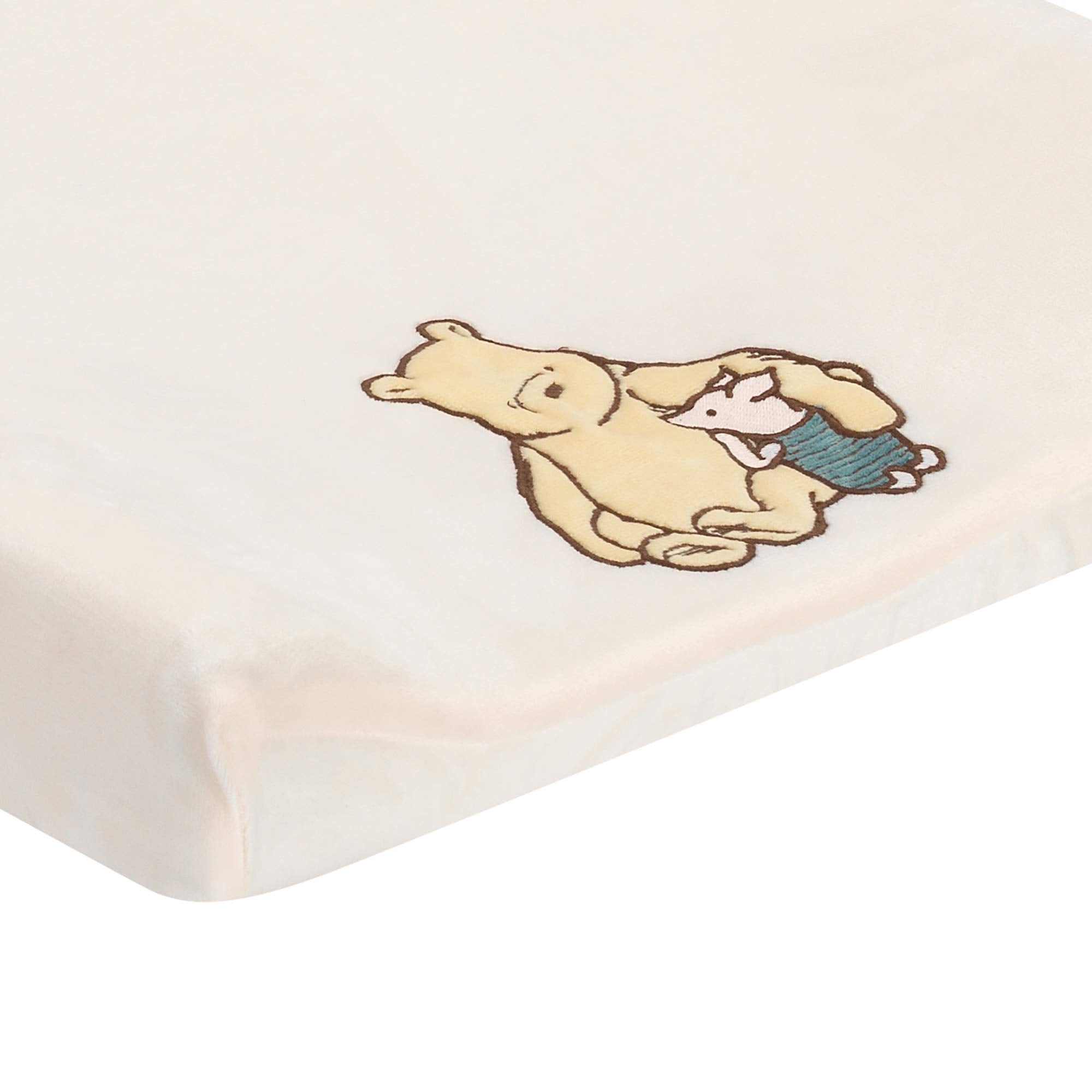 Lambs & Ivy Storytime Pooh minky fabric close-up emphasizes soft warmth for diaper changes.