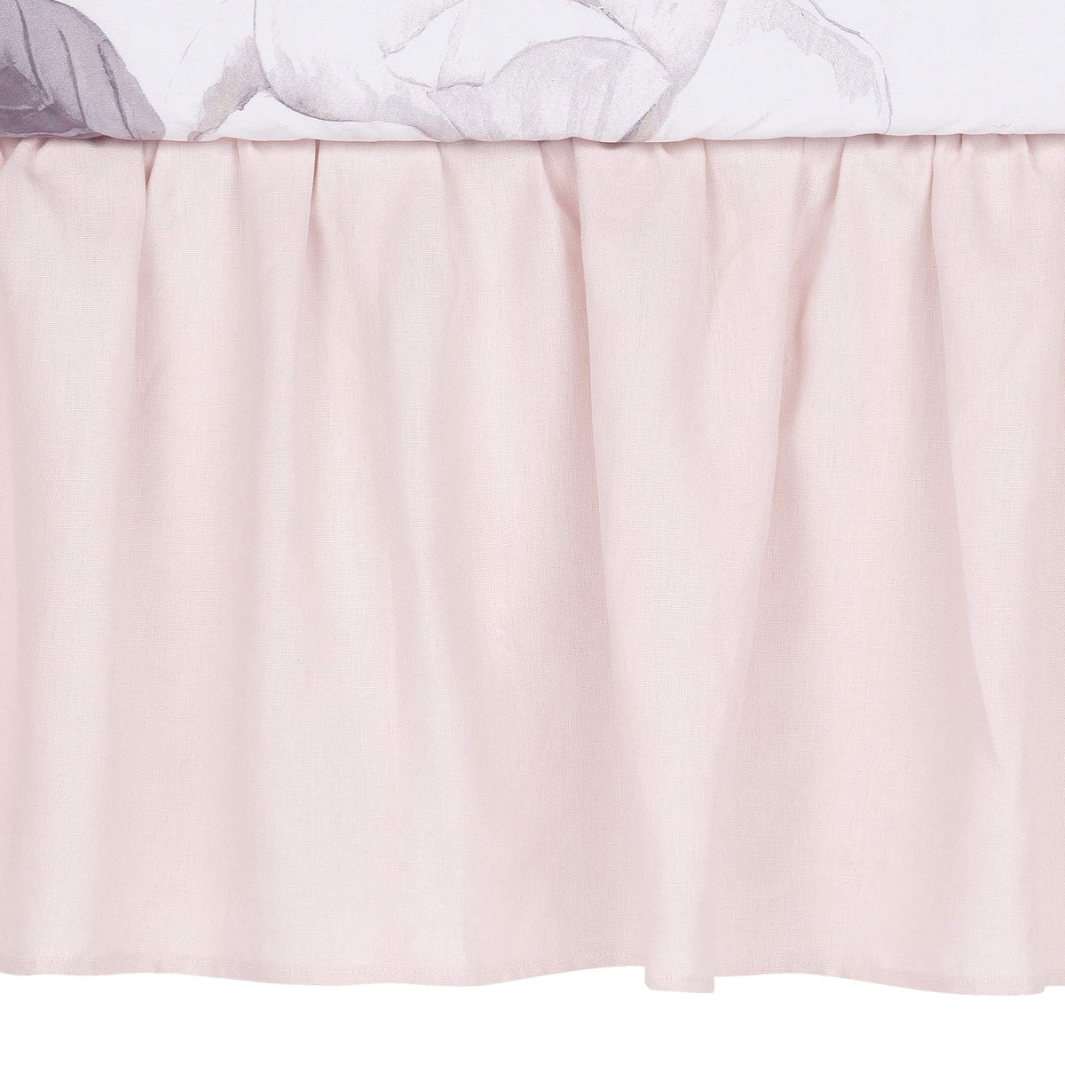 Lambs & Ivy Floral Garden pink linen crib skirt with shirred, 14.5-inch drop for a soft drape.