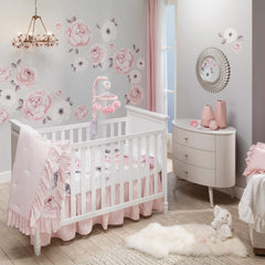 Lambs & Ivy Floral Garden pink linen crib skirt adds luxury to nursery décor.