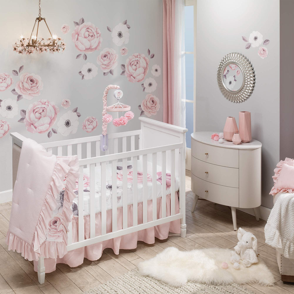 Lambs & Ivy Floral Garden quilt pink side provides cozy tactile feel for baby naps.