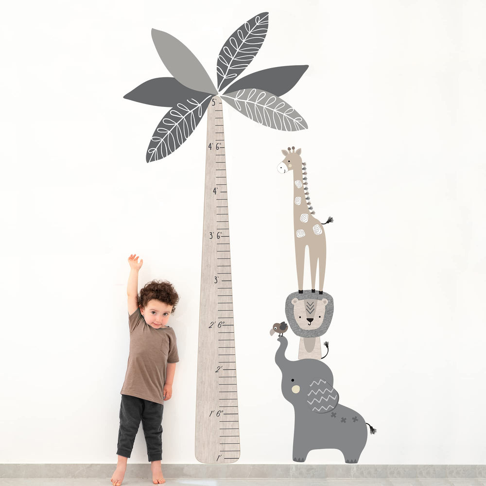 Lambs & Ivy Jungle Safari giraffe topper height chart enhances room decor while measuring growth.