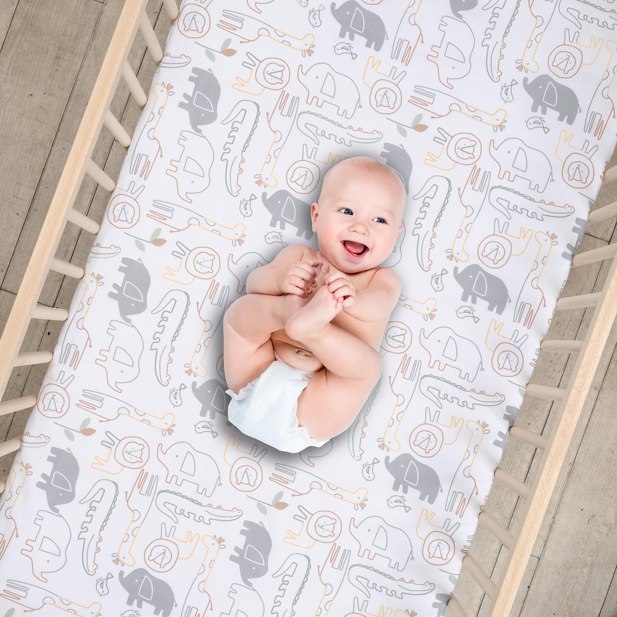 Lambs & Ivy Jungle Story crib sheet elastic edge shows snug fit for standard mattresses.