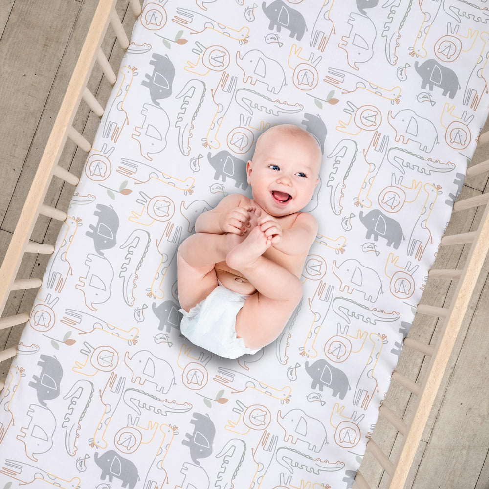 Lambs & Ivy Jungle Story crib sheet elastic edge shows snug fit for standard mattresses.