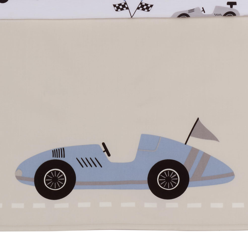 Lambs & Ivy Little Racer checkered flag detail reinforces race-themed design.