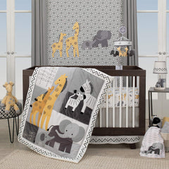 Lambs & Ivy Me & Mama elephant lamp placed in a coordinated nursery scene