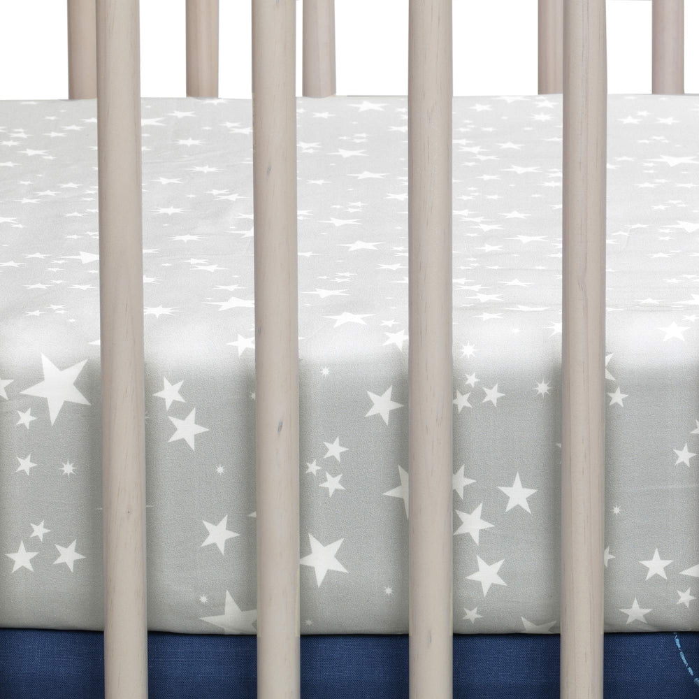 Lambs & Ivy Milky Way crib sheet folded shows easy care and secure fit.