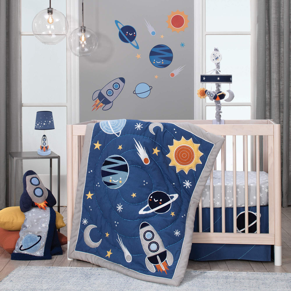 Lambs & Ivy Milky Way crib sheet on mattress demonstrates starry styling for neutral nursery.
